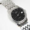 Ladies Omega de Ville Prestige Ref. 566.1050. Automatic movement. Steel case and black dial. Integrated original bracelet.