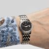 Ladies Omega de Ville Prestige Ref. 566.1050. Automatic movement. Steel case and black dial. Integrated original bracelet.