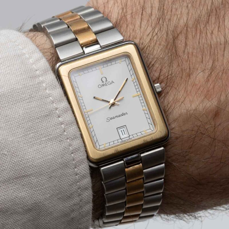 Square Omega Seamaster from 1984 Ref. 396.1004. Quartz movment. Gold bezel and white dial.
