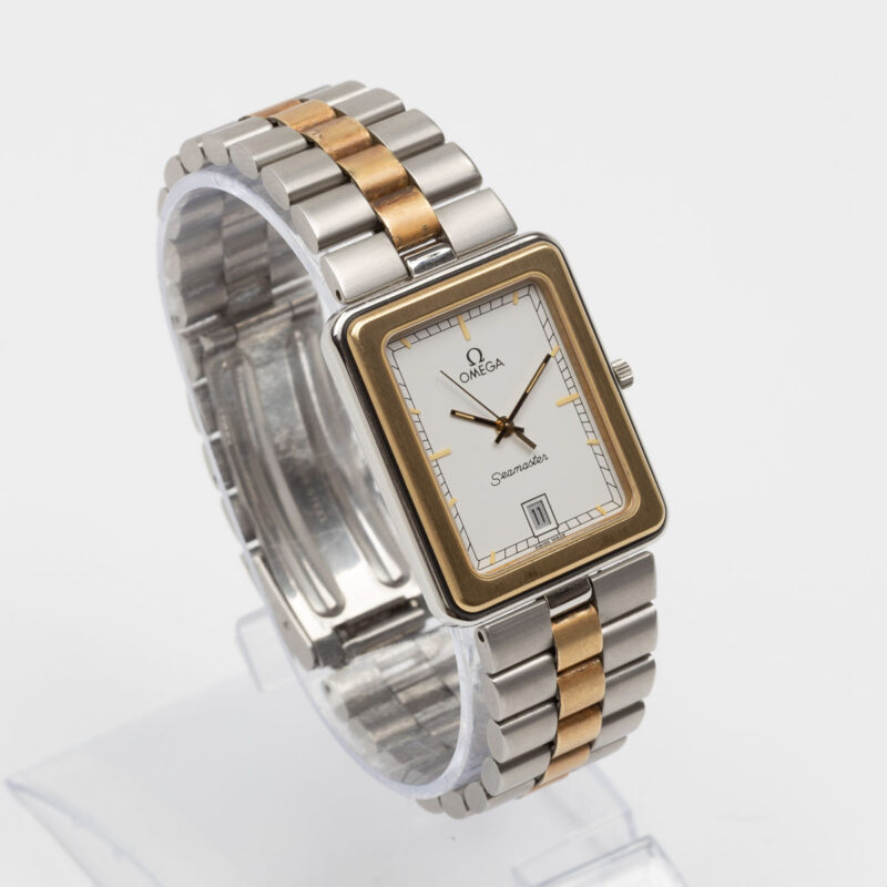 Square Omega Seamaster from 1984 Ref. 396.1004. Quartz movment. Gold bezel and white dial.