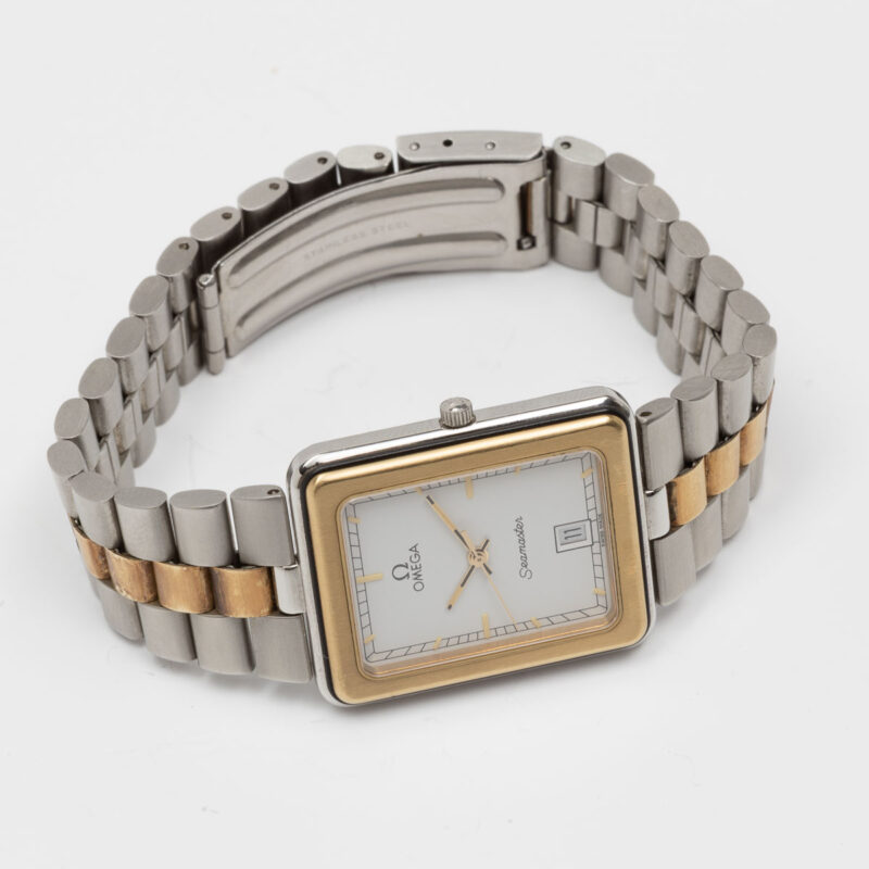 Square Omega Seamaster from 1984 Ref. 396.1004. Quartz movment. Gold bezel and white dial.