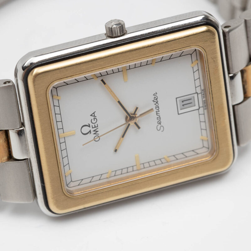 Square Omega Seamaster from 1984 Ref. 396.1004. Quartz movment. Gold bezel and white dial.