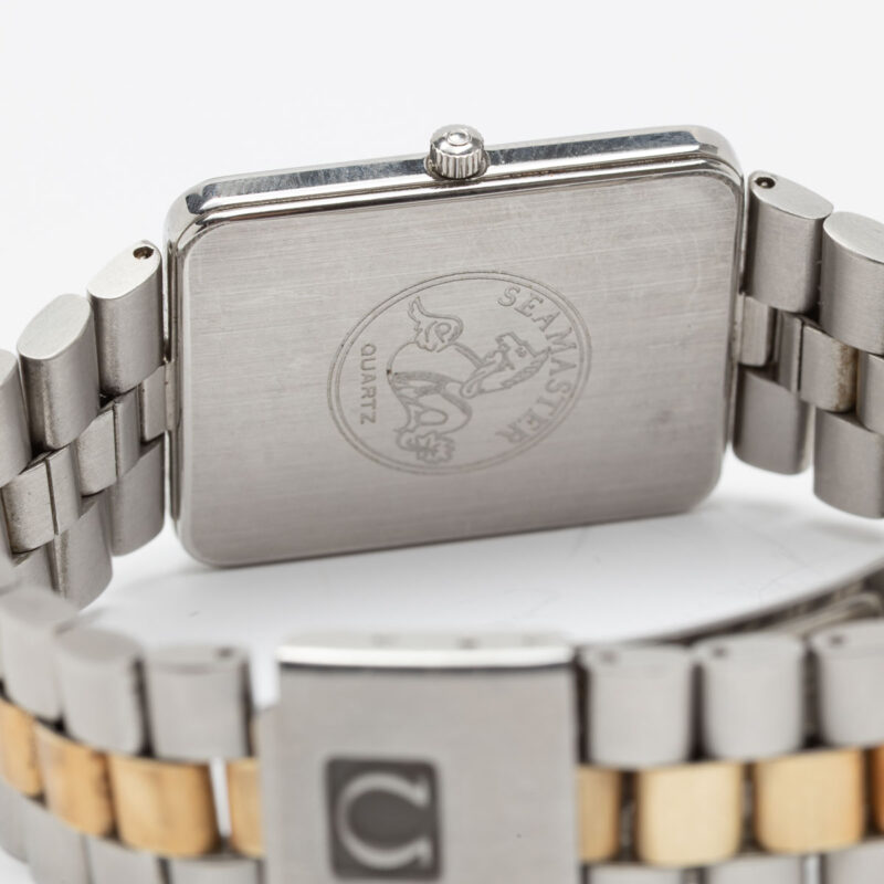 Square Omega Seamaster from 1984 Ref. 396.1004. Quartz movment. Gold bezel and white dial.