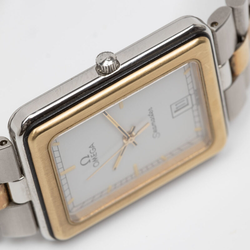 Square Omega Seamaster from 1984 Ref. 396.1004. Quartz movment. Gold bezel and white dial.