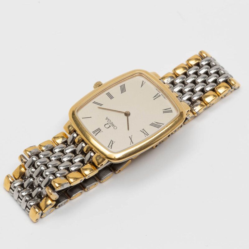 Omega de Ville from 1990s Ref. 3950876. Quartz movement. Gold on steel. Roman indexes on white dial.