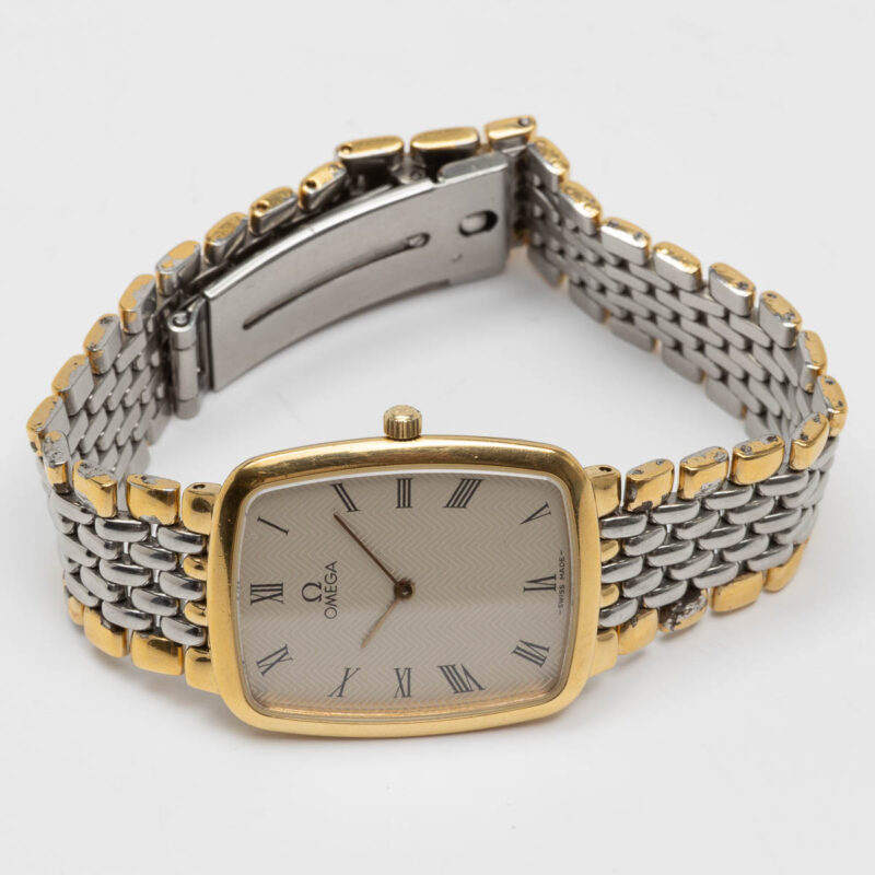 Omega de Ville from 1990s Ref. 3950876. Quartz movement. Gold on steel. Roman indexes on white dial.