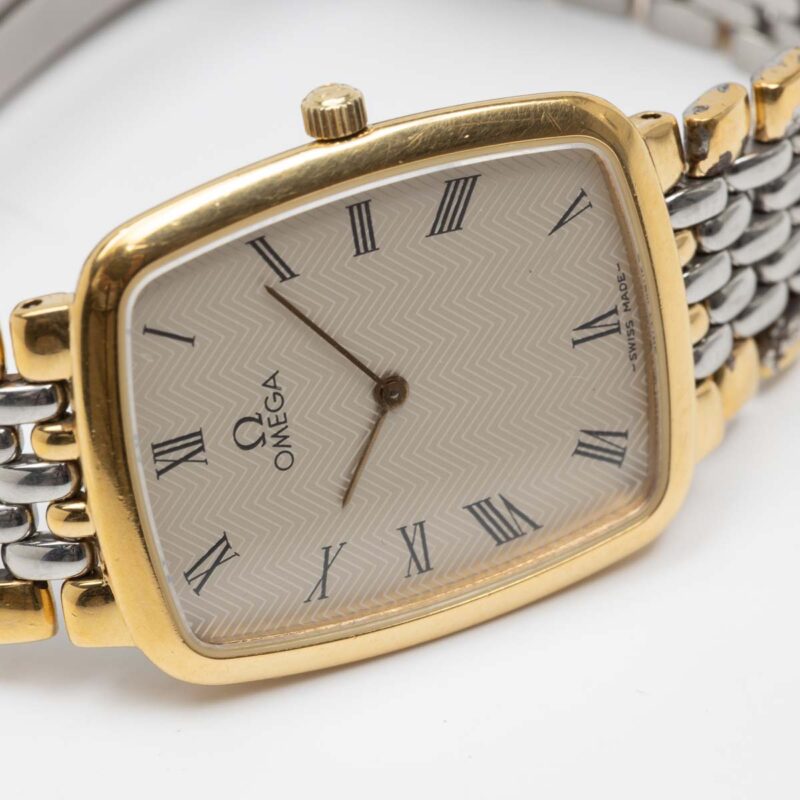 Omega de Ville from 1990s Ref. 3950876. Quartz movement. Gold on steel. Roman indexes on white dial. Quartz movement Its 26 mm size without crown.