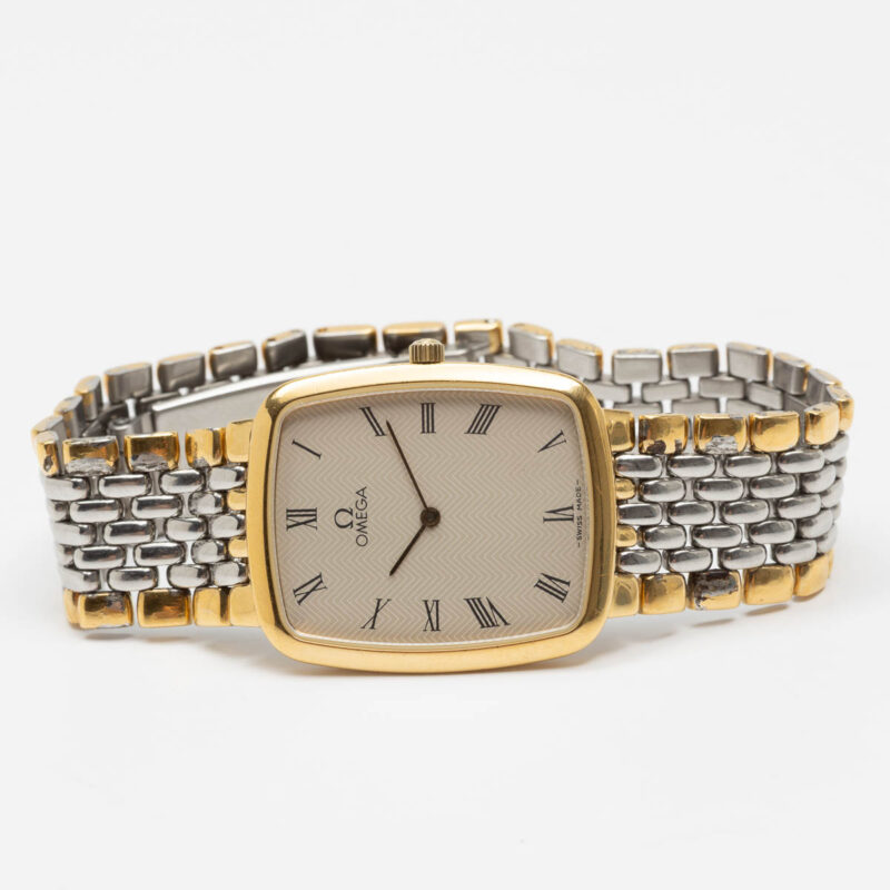 Omega de Ville from 1990s Ref. 3950876. Quartz movement. Gold on steel. Roman indexes on white dial.