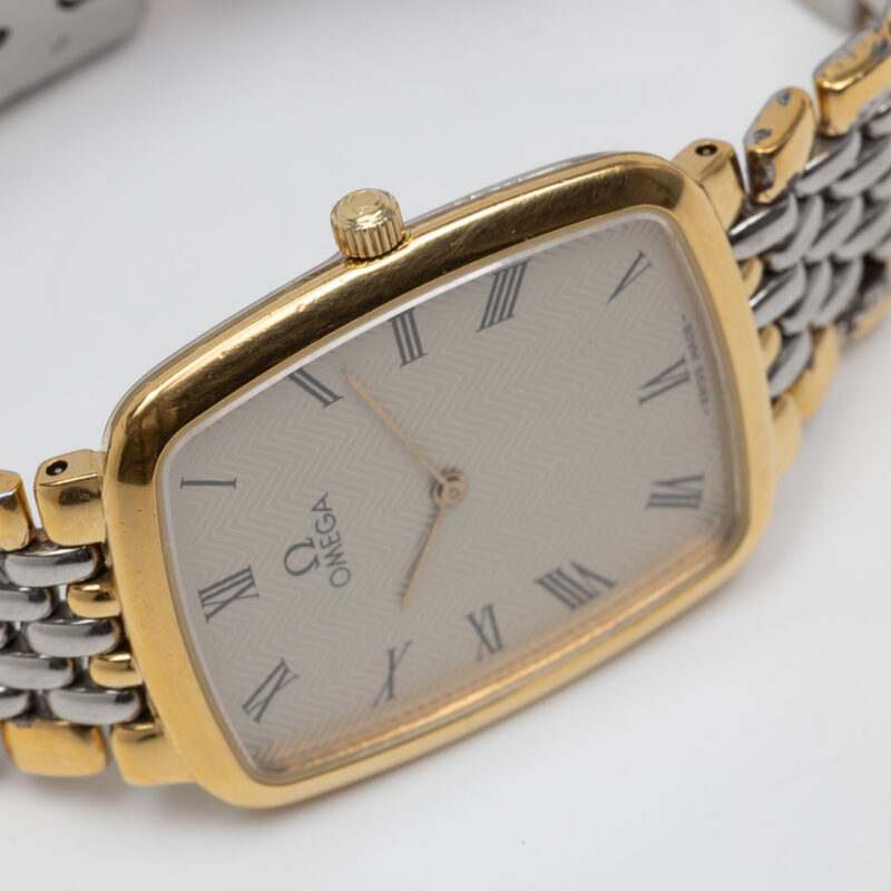 Omega de Ville from 1990s Ref. 3950876. Quartz movement. Gold on steel. Roman indexes on white dial.