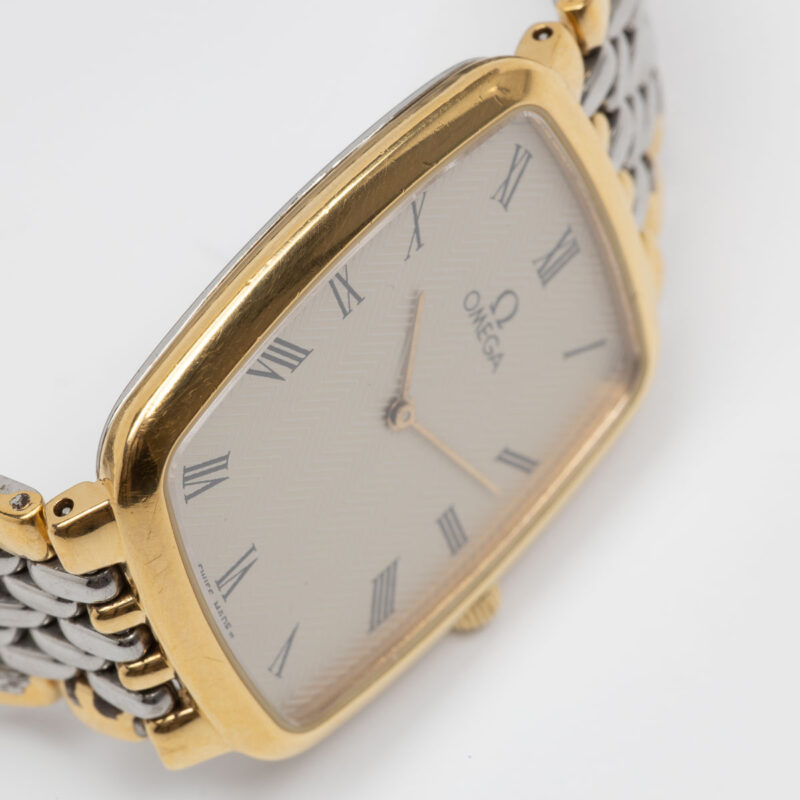 Omega de Ville from 1990s Ref. 3950876. Quartz movement. Gold on steel. Roman indexes on white dial. 26 mm size without crown.