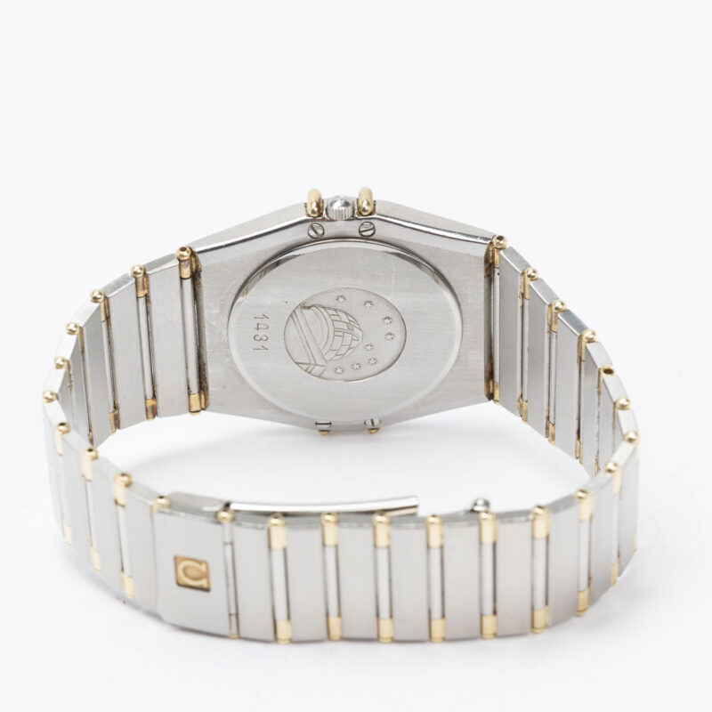 Omega Constellation Manhattan date Cal. 1431 Ref. 1980140. Quartz. Gold bezel.